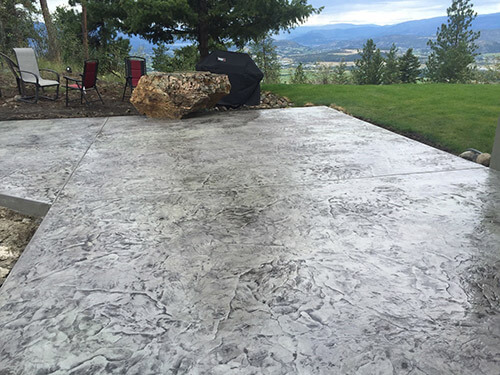 Concrete crew preparing and placing a residential slab