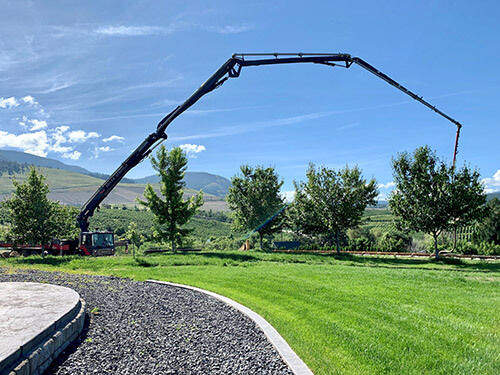 Silver Springs Concrete boom pump placing concrete on a Kelowna site